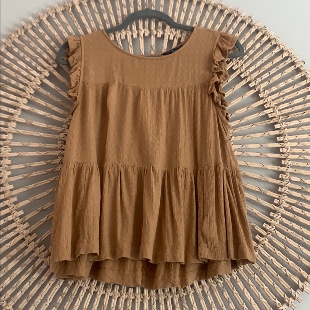 Orange/tan colored tank